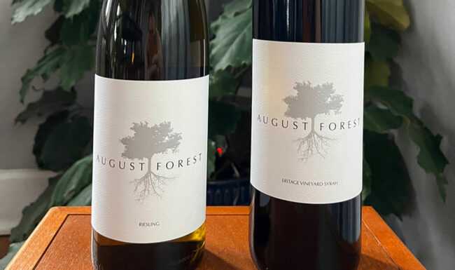 Close up of two August Forest wine bottles
